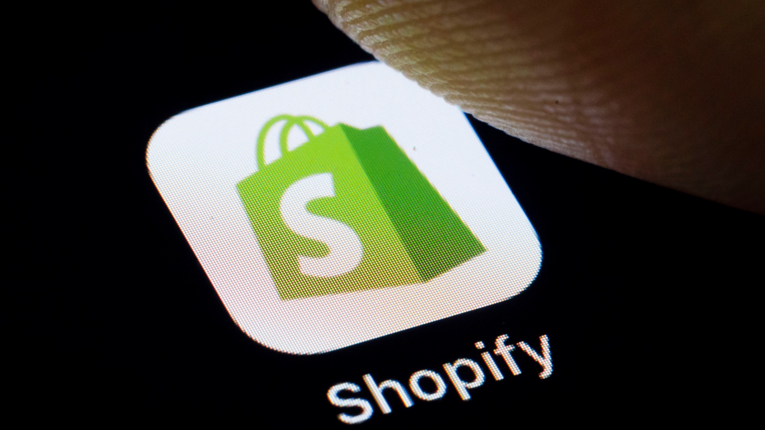 the logo of Canadian e-commerce company Shopify Inc. is displayed on a smartphone