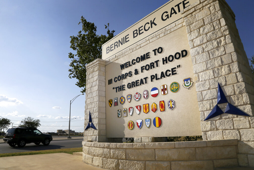 Traffic flows through the main gate past a welcome sign in Fort Hood, Texas. A new study finds that female soldiers at Army bases in Texas, Colorado, Kansas and Kentucky face a greater risk of sexual assault and harassment than those at other posts, accounting for more than a third of all active duty Army women sexually assaulted in 2018. The study by RAND Corporation was released Friday.