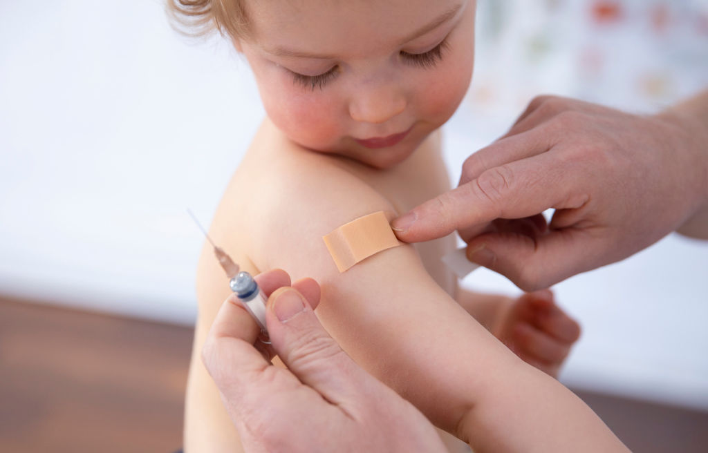 A photo of a child getting a vaccination.