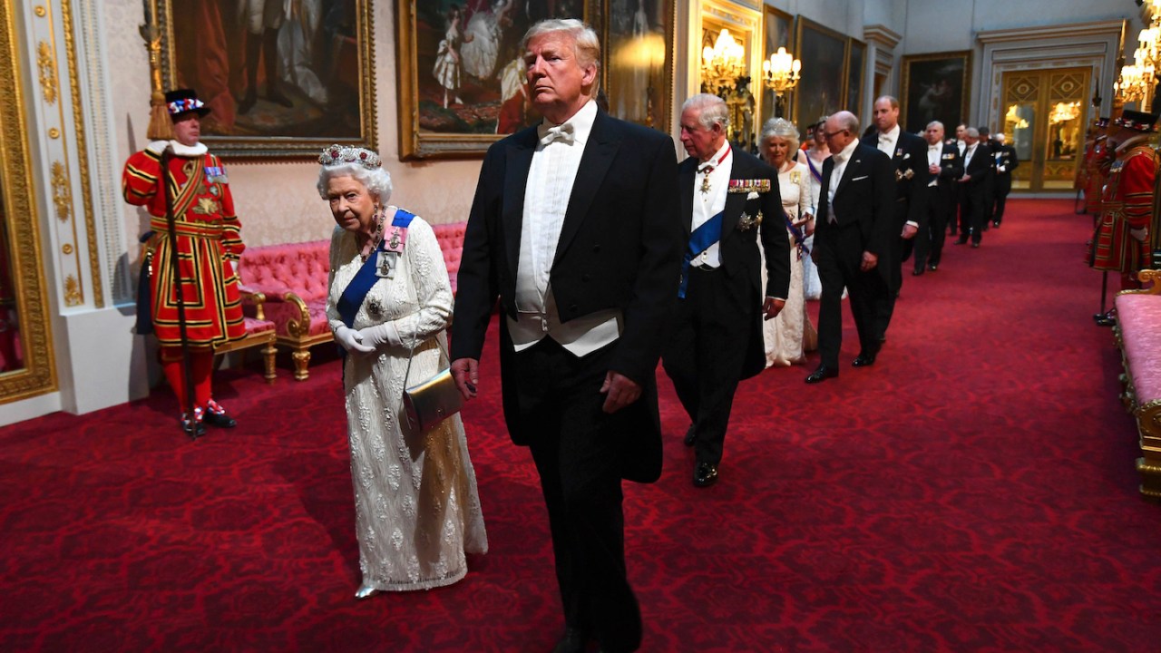 Queen Elizabeth and Trump walking into an event