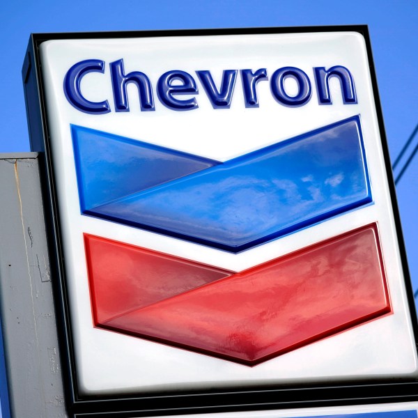 A Chevron sign is displayed outside one of the company's gas stations in Bradenton, Fla.