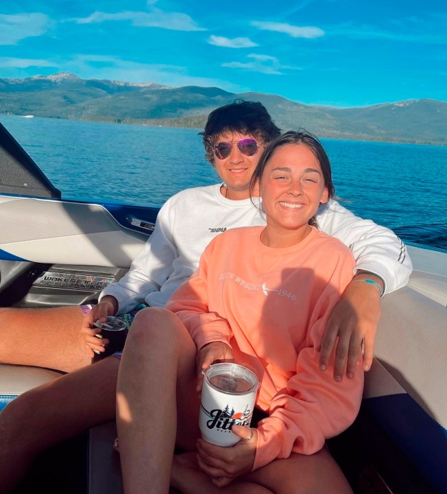 Xana Kernodle and Ethan Chapin smiling on a boat