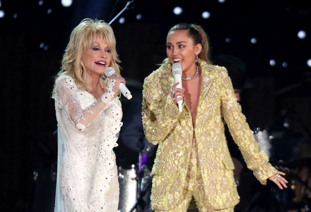 Dolly Parton and Miley Cyrus perform onstage