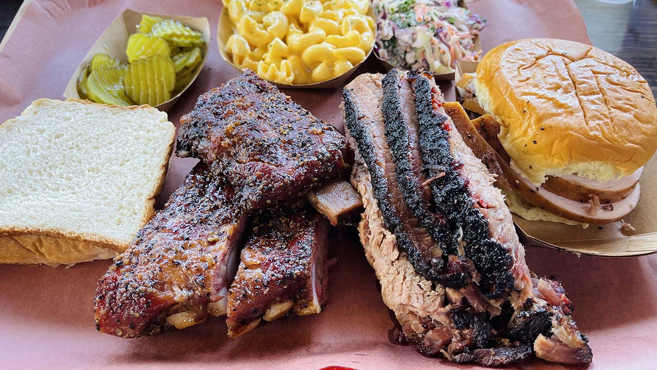 spread of barbecue ribs, brisket, and sides