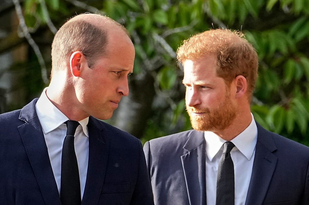 FILE - Britain's Prince William and Britain's Prince Harry walk beside each other after viewing the floral tributes for the late Queen Elizabeth II outside Windsor Castle, in Windsor, England, Saturday, Sept. 10, 2022. Court papers say that Prince William quietly received “a very large sum of money” in a 2020 phone hacking settlement with the British newspaper arm of Rupert Murdoch’s media empire. Court documents aired Tuesday in one of his brother's lawsuits against British newspapers says the Prince of Wales, heir to the British throne, quietly received a settlement in 2020. (AP Photo/Martin Meissner, File)