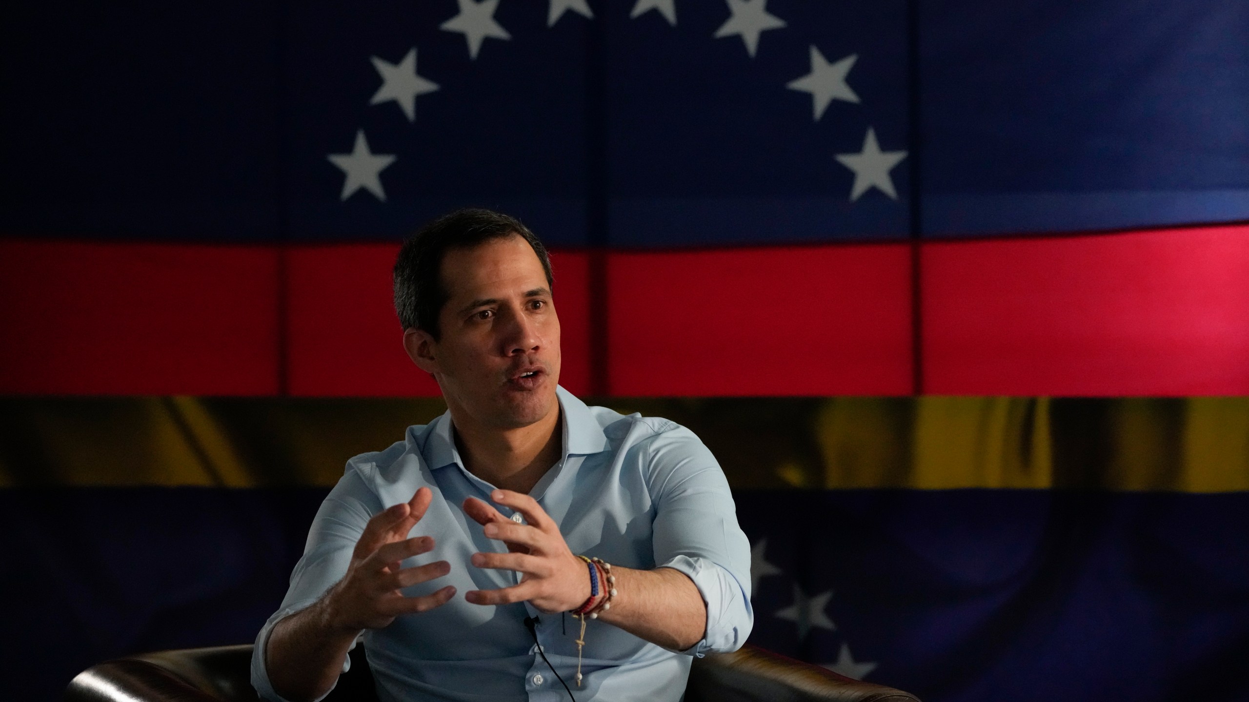 FILE - Opposition leader Juan Guaido speaks during an interview with the Associated Press in Caracas, Venezuela, Thursday, Feb. 10, 2022. Guaido said on Tuesday, April 25, 2023, that he is not seeking political asylum in the United States and has not ruled out the possibility of running in a presidential primary planned for October. (AP Photo/Ariana Cubillos, File)