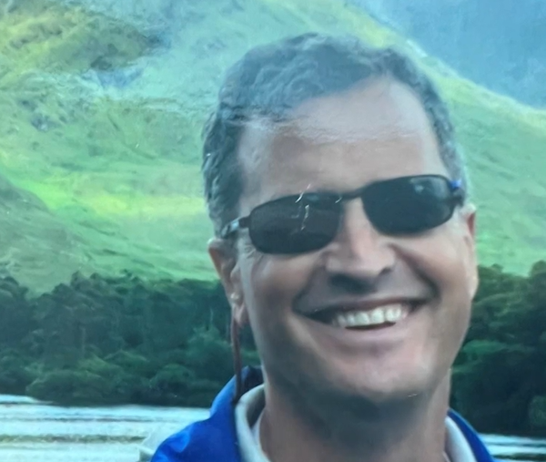 Marc Fogel smiles while wearing sunglasses.