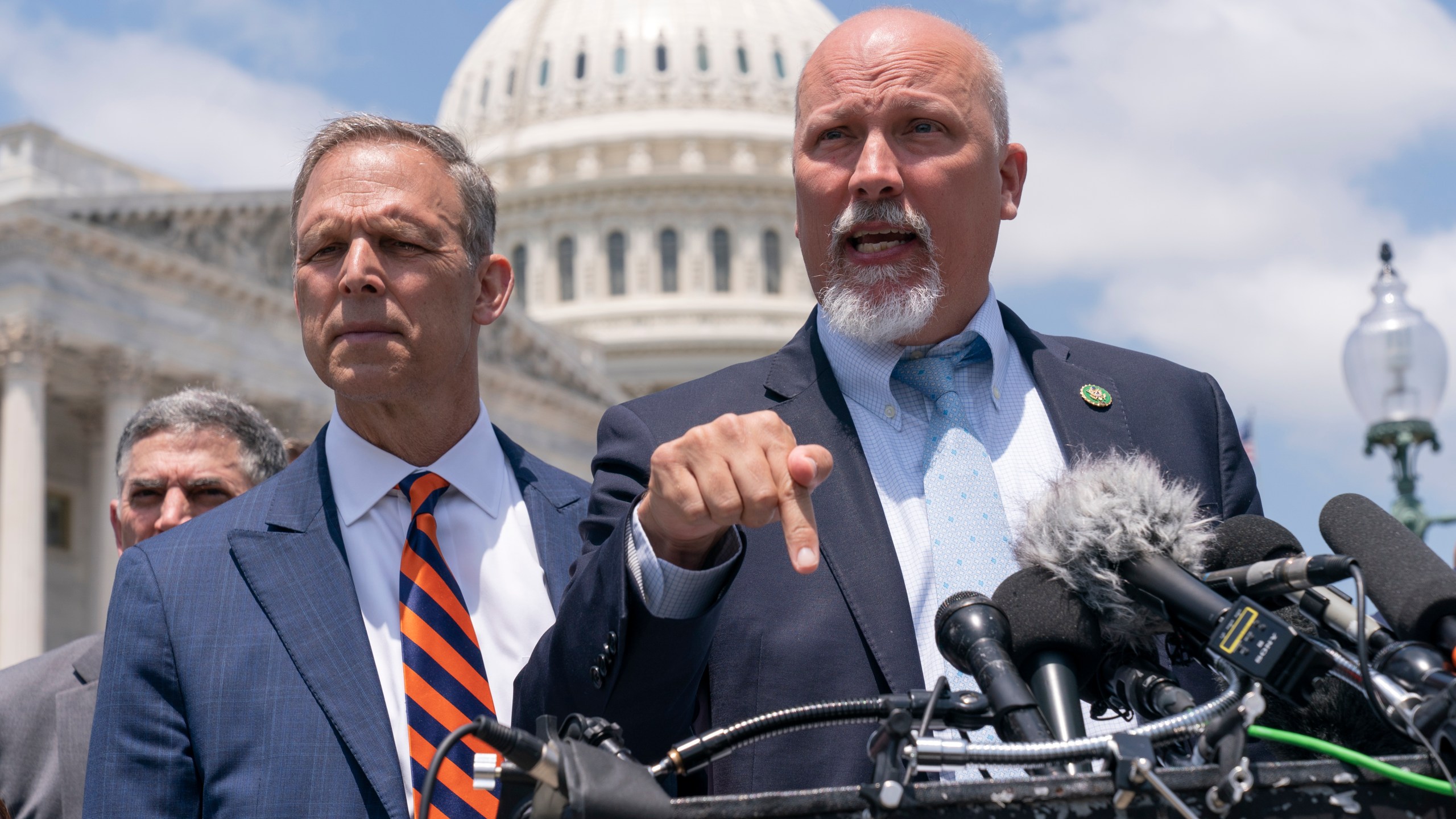 Rep. Scott Perry, R-Pa., left, and Rep. Chip Roy, R-Texas, speak with reporters as member of the conservative House Freedom Caucus talk about the debt limit deal, during a news conference, Tuesday, May 30, 2023, on Capitol Hill in Washington. (AP Photo/Jacquelyn Martin)