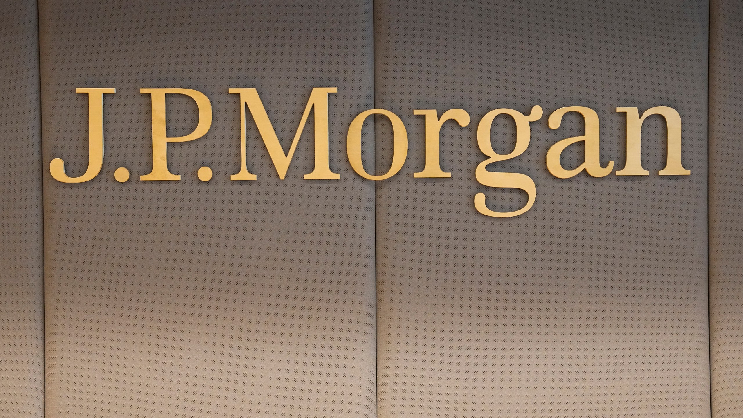 FILE - The logo of JPMorgan bank is pictured at the new French headquarters of JP Morgan bank, Tuesday, June 29, 2021, in Paris. JPMorgan Chase is defending itself against a lawsuit by the U.S. Virgin Islands accusing it of empowering Jeffrey Epstein to abuse teenage girls. Lawyers for the giant bank said in court papers Tuesday, May 23, 2023, that it was the islands that enabled the financier to commit his crimes. (AP Photo/Michel Euler, Pool, File)