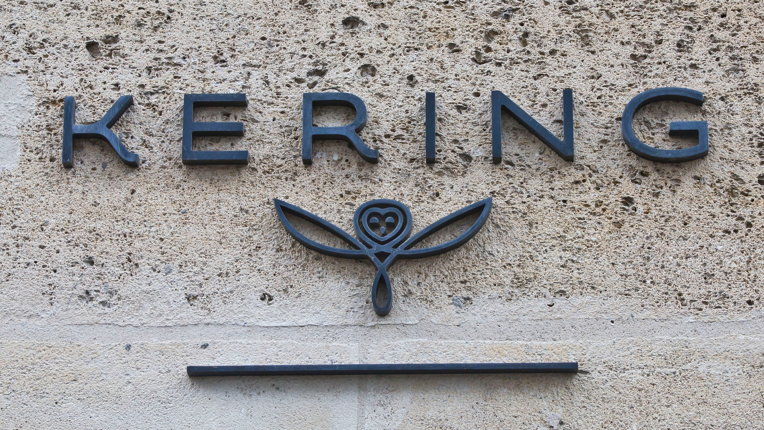 FILE - The logo of French luxury group Kering is pictured in Paris, France, on Sept. 15, 2017. French luxury conglomerate Kering has reached a cash deal to purchase a 30% stake in Italian fashion house Valentino for 1.7 billion euros from a Qatari investment firm. Under the deal announced Thursday, July 27, 2023, Kering has the option to buy 100% of Valentino no later than 2028. (AP Photo/Michel Euler, File)