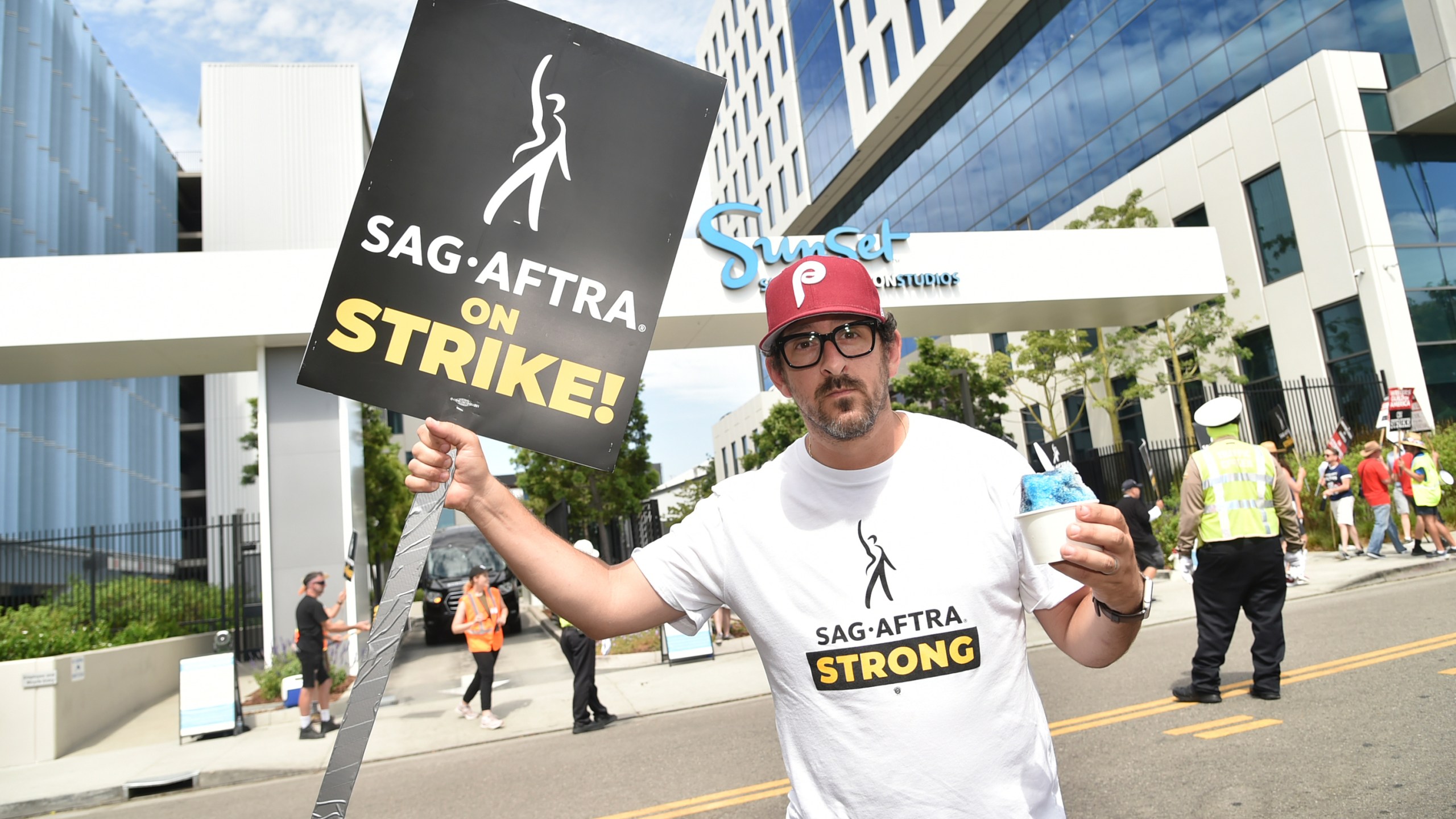 Adam Shapiro poses on a picket line outside Netflix studios on Tuesday, Aug. 1, 2023, in Los Angeles. The actors strike comes more than two months after screenwriters began striking in their bid to get better pay and working conditions. (Photo by Richard Shotwell/Invision/AP)