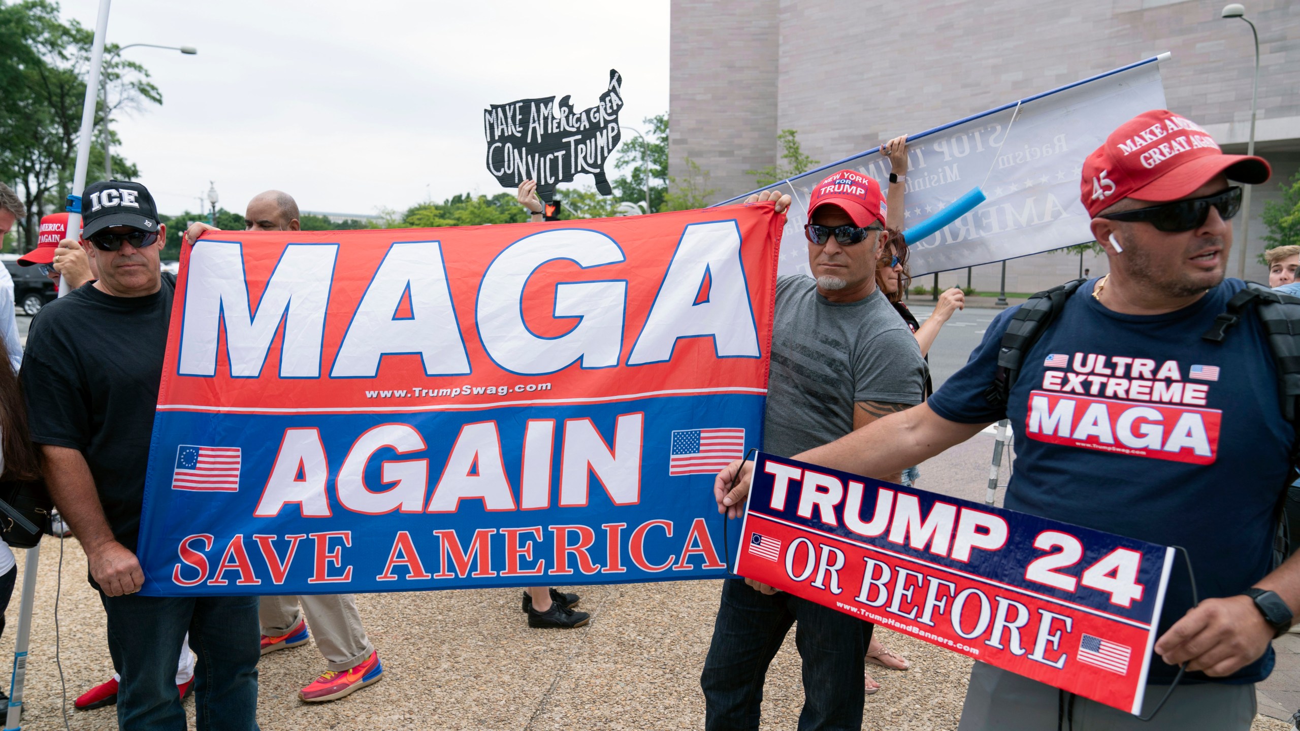 Supporters of former President Donald Trump rally outside the E. Barrett Prettyman U.S. Federal Courthouse, Thursday, Aug. 3, 2023, in Washington. Trump is due in federal court in Washington today, to answer charges he sought to overturn his 2020 presidential election loss. (AP Photo/Jose Luis Magana)