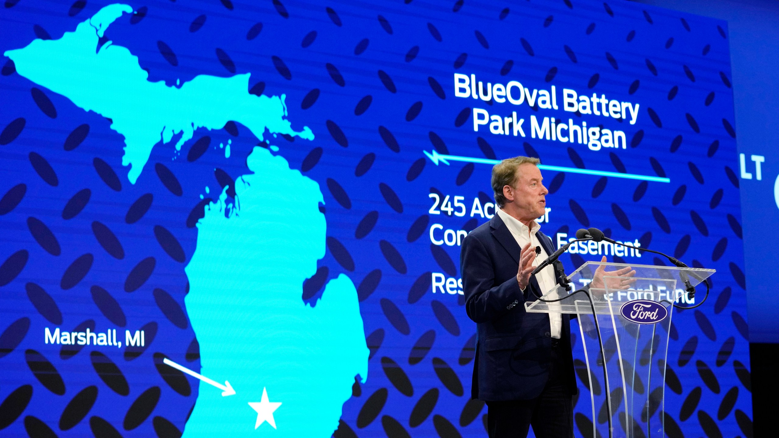 FILE - Ford Motor Co. Executive Chairman Bill Ford announces the automaker's new BlueOval Battery Park, Feb. 13, 2023, in Romulus, Mich. Ford Motor Co. said Monday, Sept. 25, that it's pausing construction of the $3.5 billion electric vehicle battery plant in Michigan until it is confident it can run the factory competitively. (AP Photo/Carlos Osorio, File)