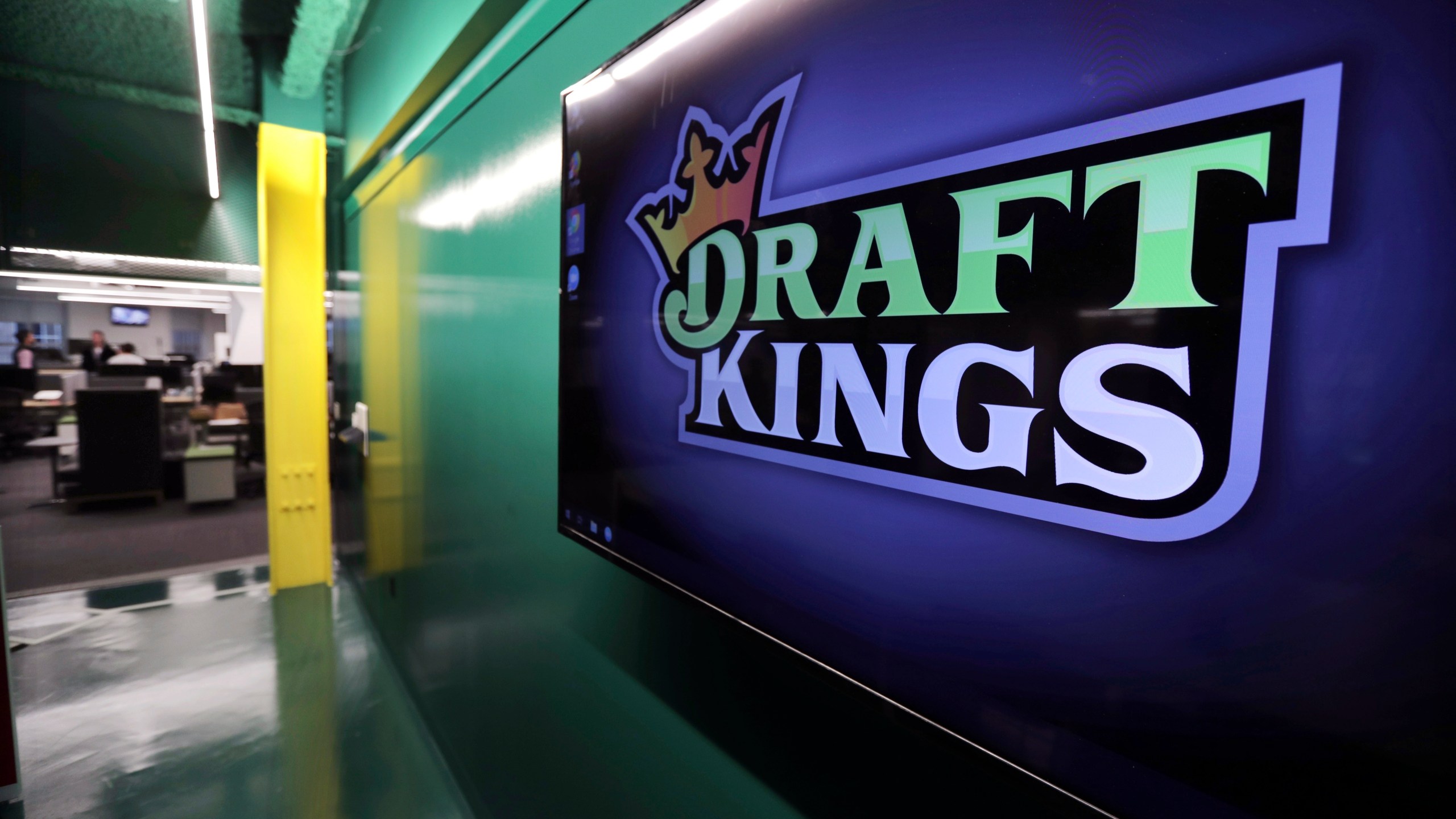 The DraftKings logo is displayed at the company headquarters in Boston.