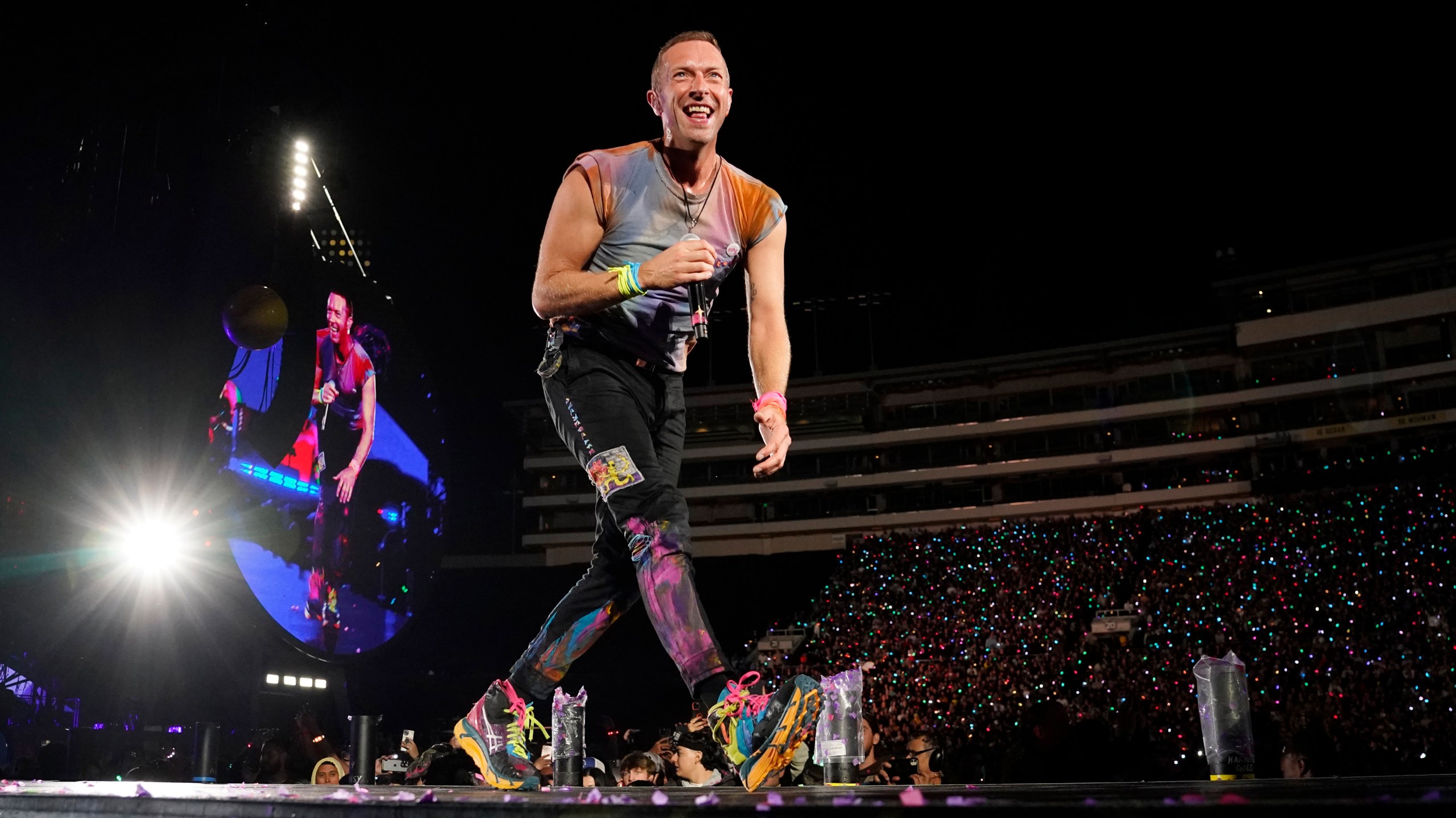 Chris Martin of Coldplay performs at the Rose Bowl, Saturday, Sept. 30, 2023, in Pasadena, Calif. (AP Photo/Chris Pizzello)