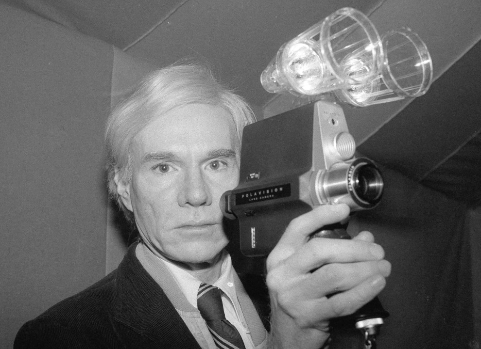FILE - Artist Andy Warhol poses on Feb. 1, 1978 in New York. The Andy Warhol Museum in Pittsburgh has announced plans to expand with a $45 million entertainment project. The proposed venue is part of the museum's Pop District initiative and would be built on an existing museum parking lot, according to Dan Law, the museum’s associate director. Plans for the project were presented to the city's Planning Commission on Tuesday, Oct. 18, 2023. (AP Photo/Dave Pickoff, File)