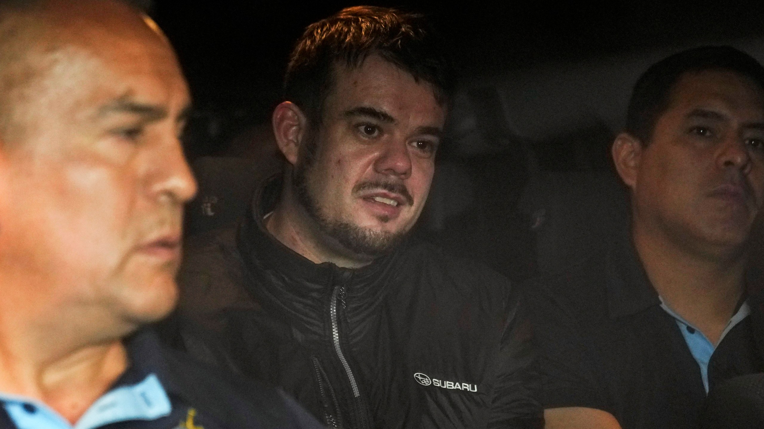 FILE - Dutch citizen Joran van der Sloot is driven in a police vehicle from a maximum-security prison to an airport to be extradited to the U.S., on the outskirts of Lima, Peru, Thursday, June 8, 2023. Van der Sloot, the chief suspect in Natalee Holloway’s 2005 disappearance, is scheduled to appear in court Wednesday morning, Oct. 18, where he is expected to plead guilty to trying to extort money from her mother and provide new information about what happened to the missing teen. (AP Photo/Martin Mejia, File)