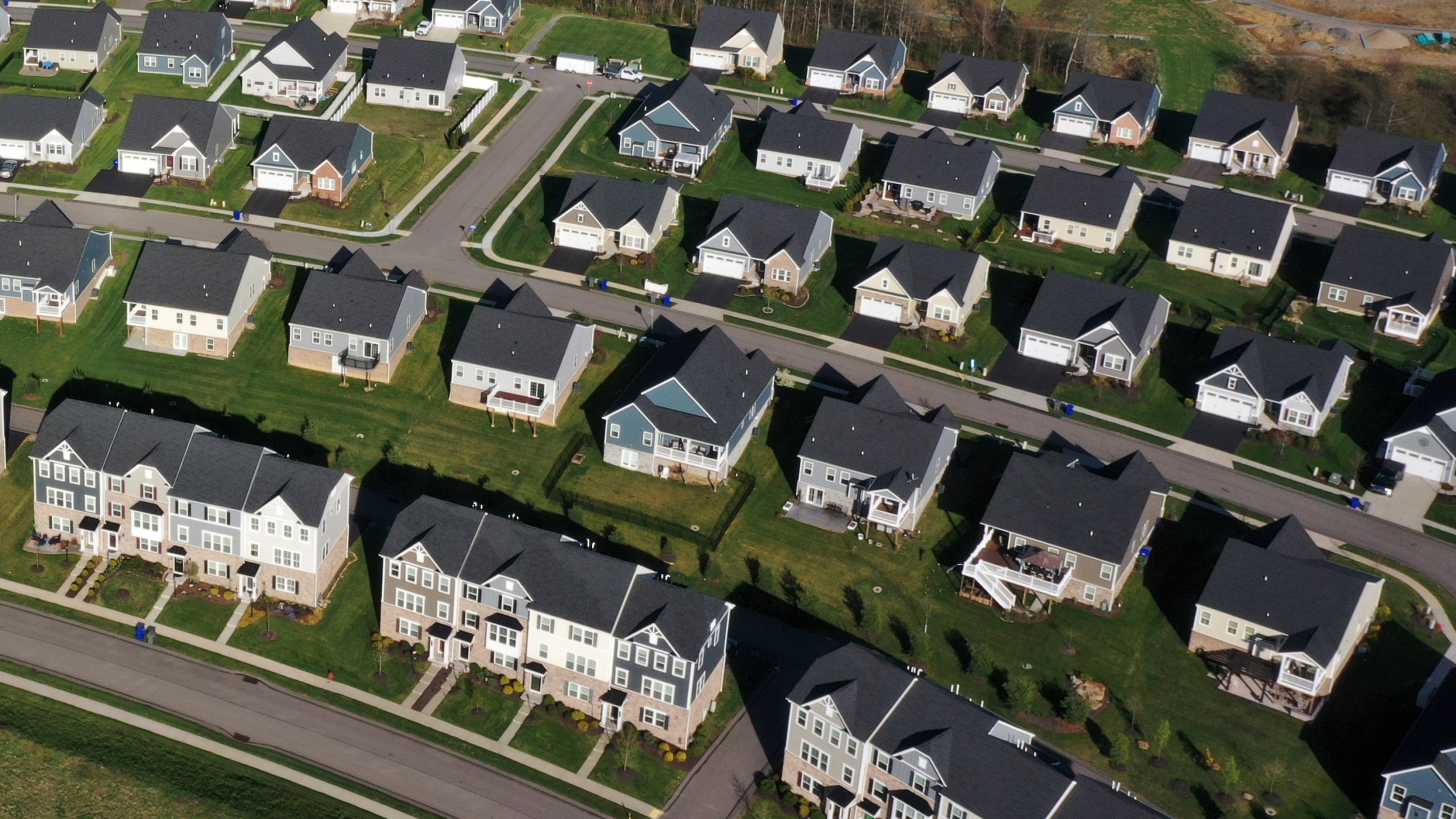 FILE - New Homes dot the landscape in Middlesex Township, Pa., on Thursday, Apr. 19, 2023. Homebuyers who can afford to bypass the highest mortgage rates in two decades are increasingly forgoing financing and paying all cash. Homes purchased entirely with cash accounted for 34.1% of all sales in September, up from 29.5% a year earlier. (AP Photo/Gene J. Puskar, File)