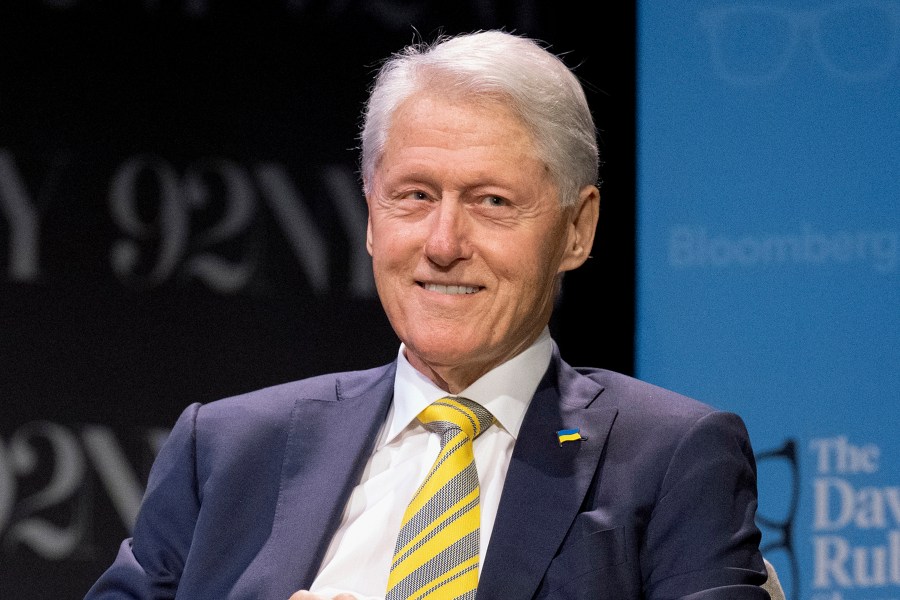 Former President Bill Clinton speaks on a panel.