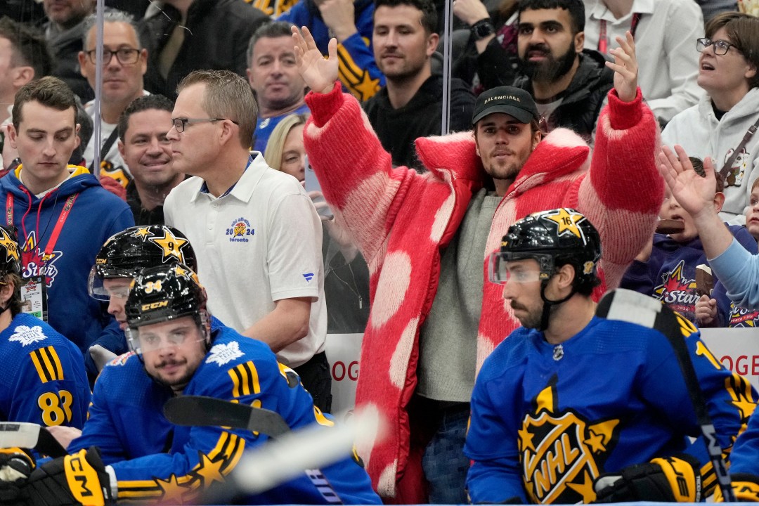 Performer Justin Bieber, center right, dances to the Village People song "Y.M.C.A." during a break in the action during hockey's NHL All-Star Game between Team Matthews and Team McDavid in Toronto, Saturday, Feb. 3, 2024. (Frank Gunn/The Canadian Press via AP)