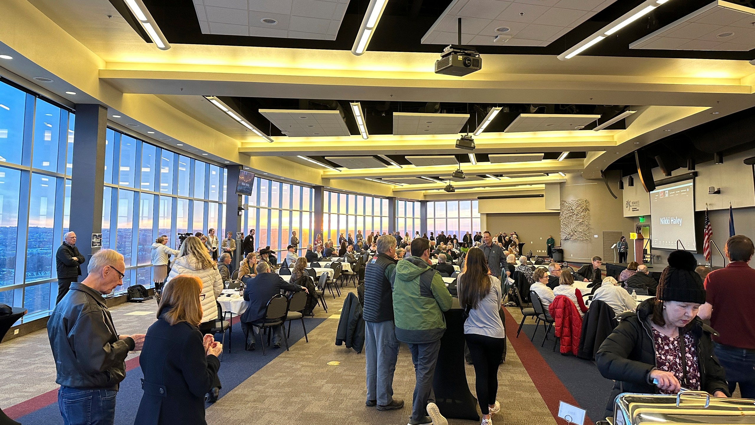 Republican presidential caucusgoers gather after voting at the caucus site, Monday, March 4, 2024, at Bismarck State College in Bismarck, N.D. Gov. Doug Burgum spoke virtually on behalf of former President Donald Trump. Former U.N. Ambassador Nikki Haley and Florida businessman David Stuckenberg also addressed caucusgoers remotely. (AP Photo/Jack Dura)