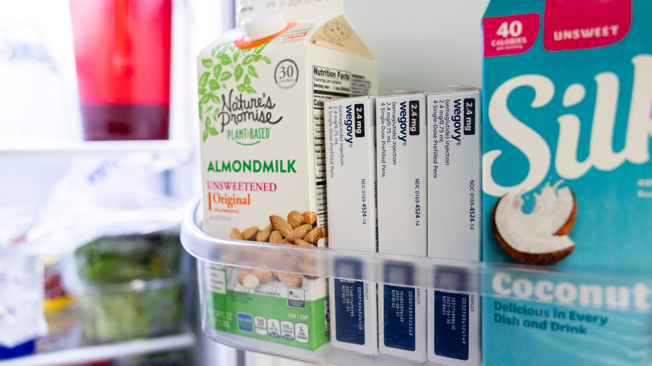 Doses of Wegovy, a drug used for weight loss, are stored in a refrigerator at Donna Cooper's home in Front Royal, Va., on Friday, March 1, 2024. “To me, it’s a help, it’s an aid,” says Cooper, 62, who lost nearly 40 pounds in nine months using Wegovy along with diet and exercise. “At some point you have to come off of them. I don’t want to be on them forever.” (AP Photo/Amanda Andrade-Rhoades)