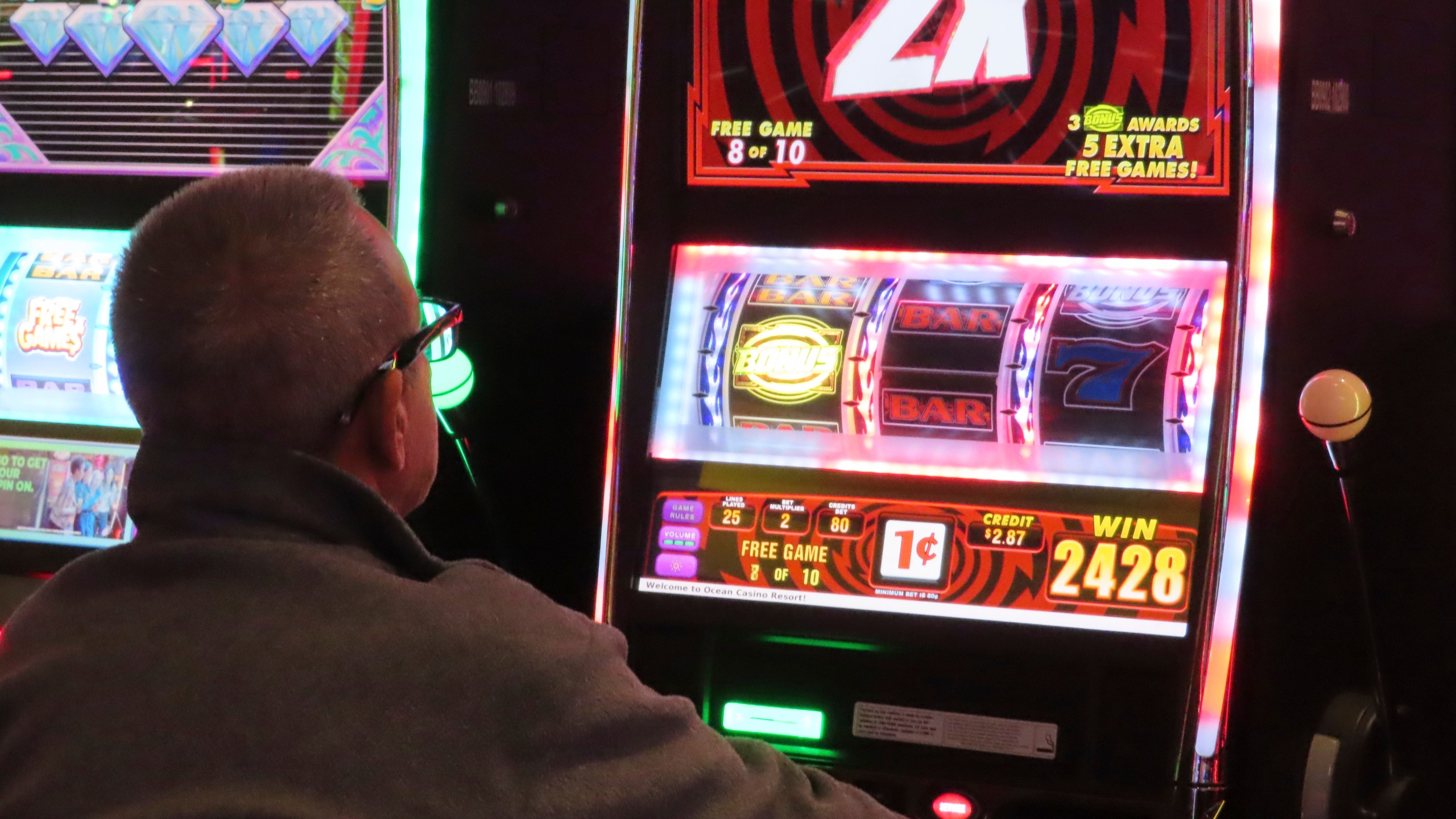 A gambler plays a slot machine at the Ocean Casino Resort in Atlantic City, New Jersey.