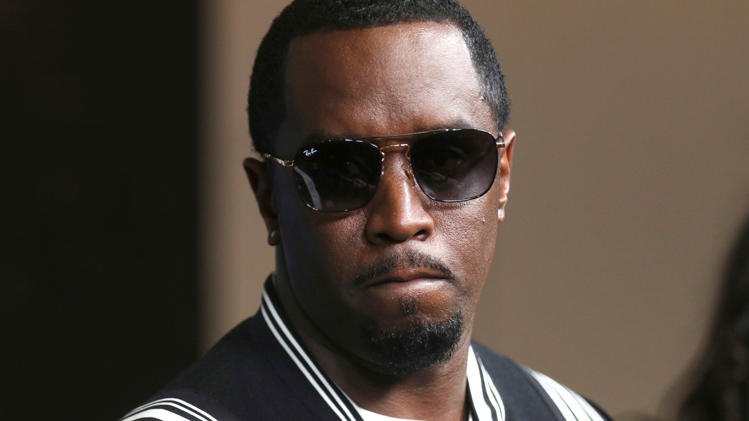Diddy arrives at a premiere
