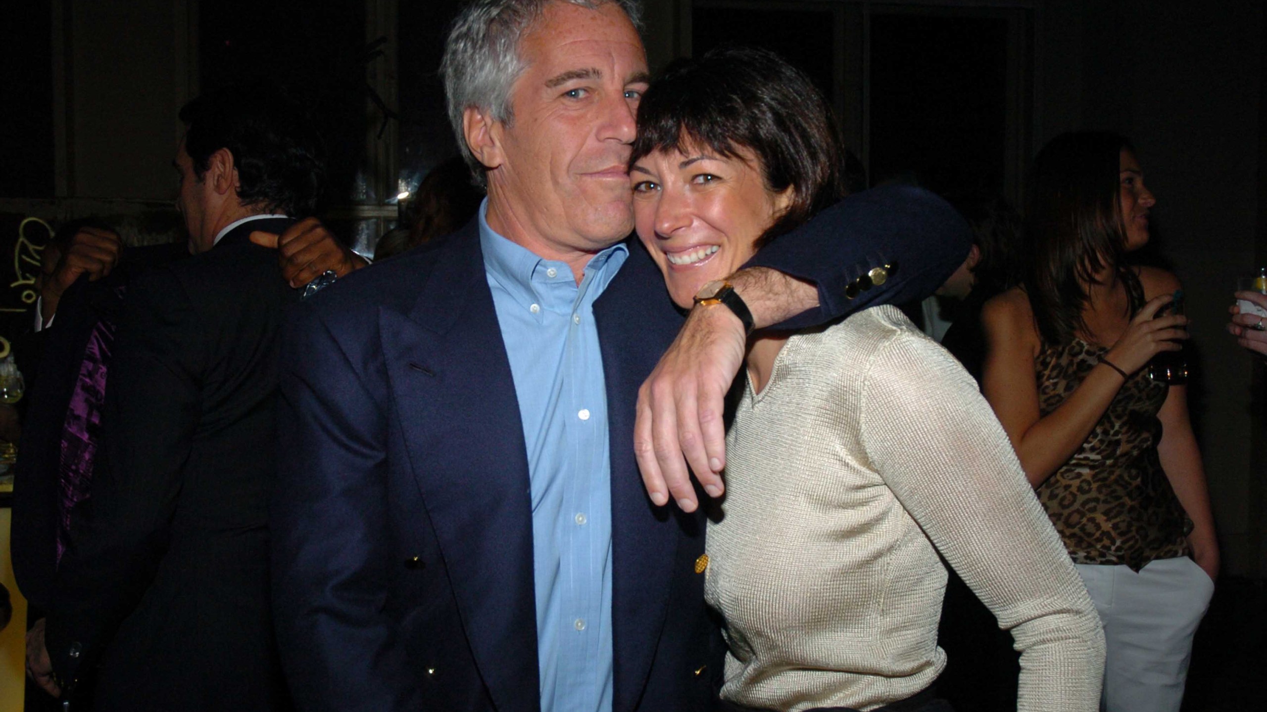 Jeffrey Epstein kisses the head of Ghislaine Maxwell