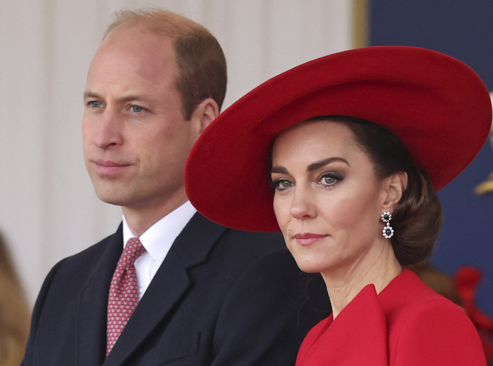 Prince William stands next to Princess Kate at an event