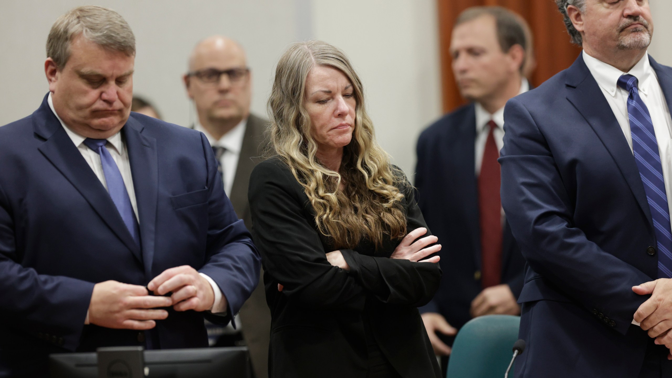 FILE - Lori Vallow Daybell stands and listens as the jury's verdict is read at the Ada County Courthouse in Boise, Idaho, May 12, 2023. The trial of Chad Daybell, the man charged with the deaths of his wife and his girlfriend's two youngest children, is set to begin in Idaho on Monday, April 1, 2024, serving as a second act in a bizarre case that has drawn worldwide attention and already resulted in a life sentence for the kids' mother, Lori Vallow Daybell. (AP Photo/Kyle Green, File)