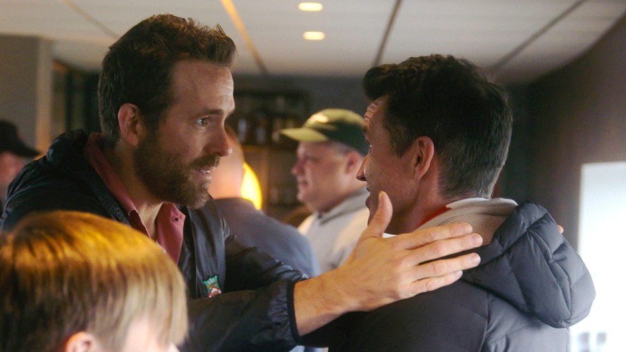 This image released by FX shows Ryan Reynolds, left, and Rob McElhenney in a scene from the third season of "Welcome to Wrexham." (FX via AP)