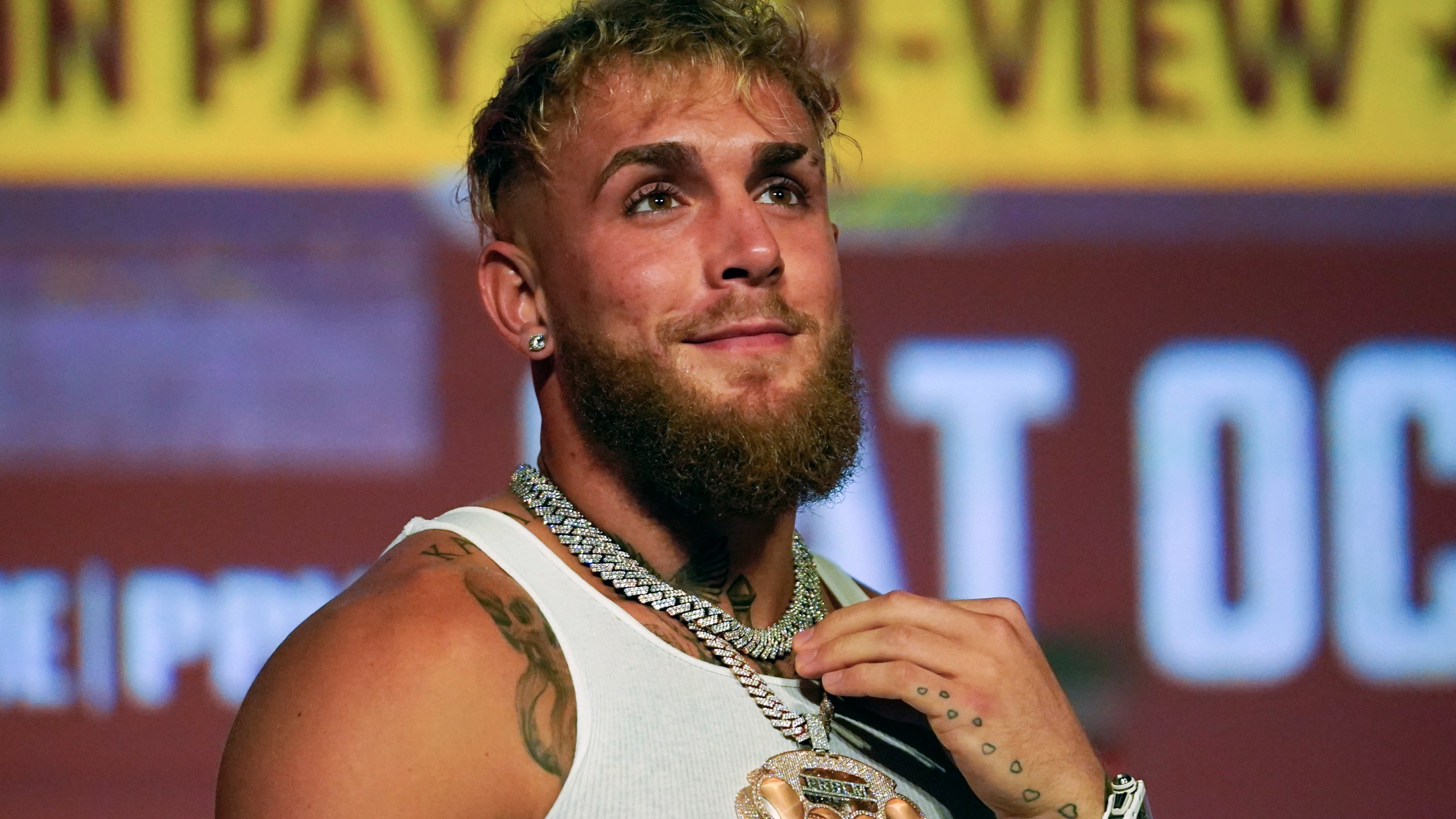 Jake Paul speaks during a news conference