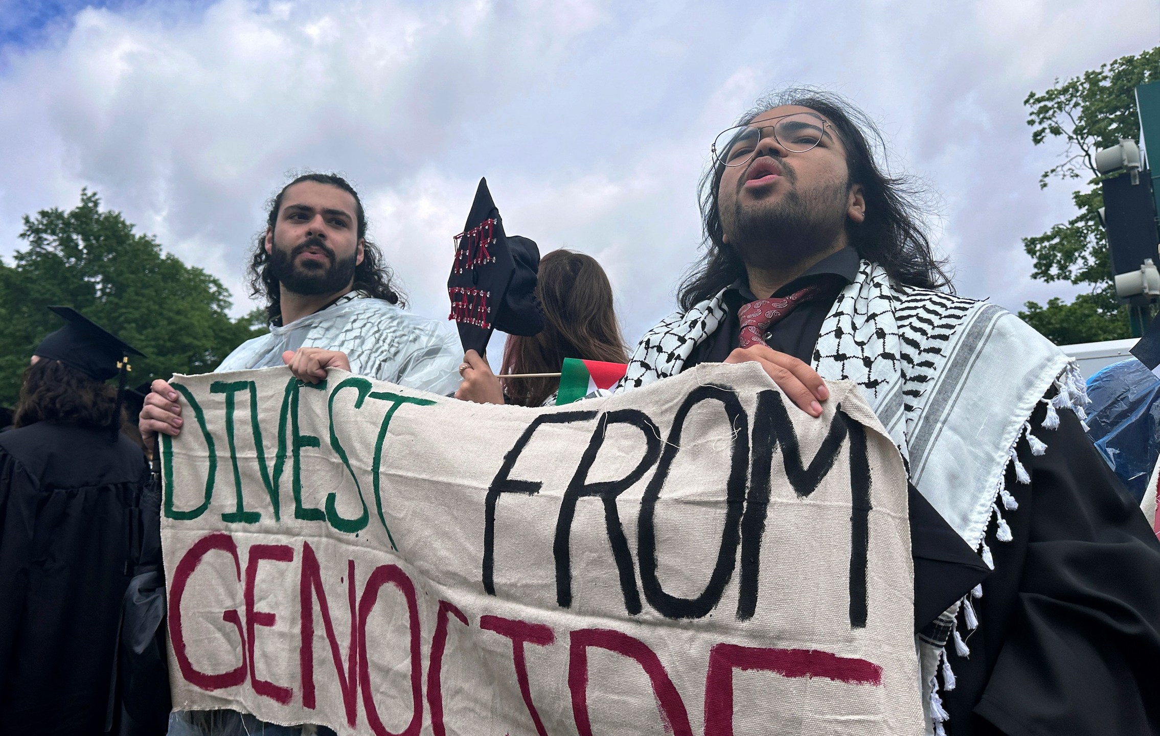 Pro-Palestian graduates leave an outdoor commencement at Massachusetts Institute of Technology in Cambridge, Mass., Thursday, May 30, 2024. (AP Photo/Michael Casey)