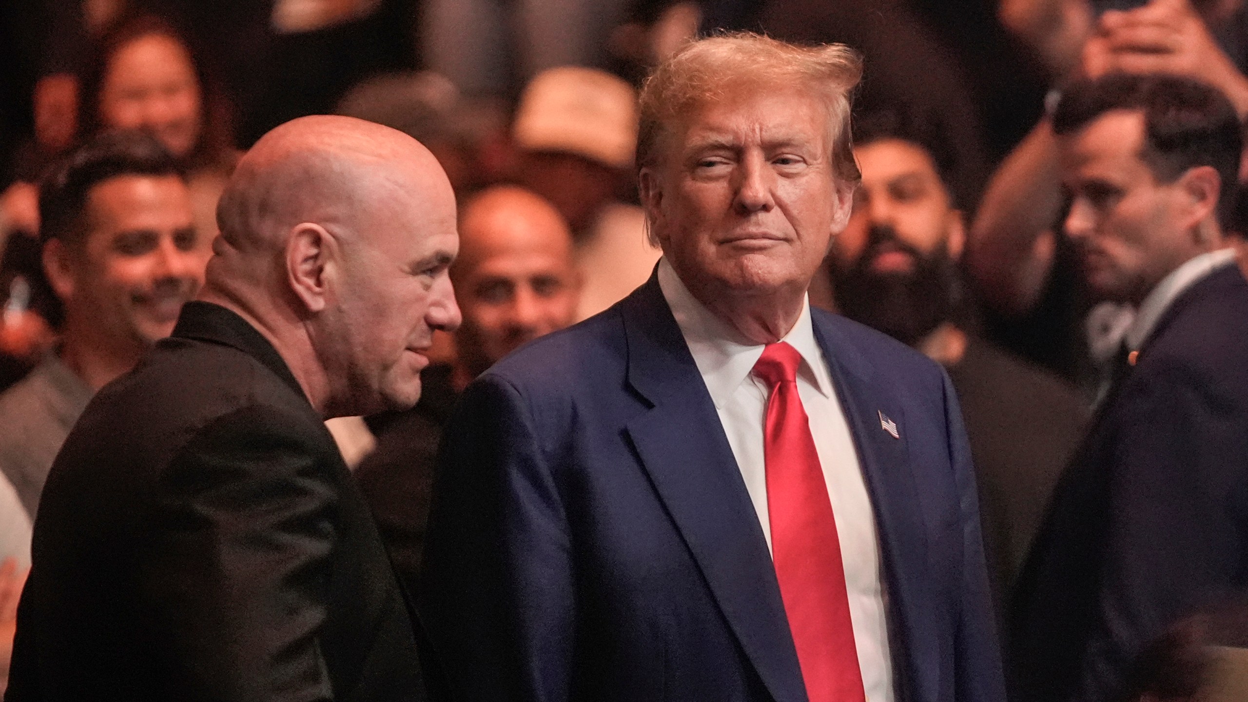 President Trump and Dana White stand next to each other at a UFC event