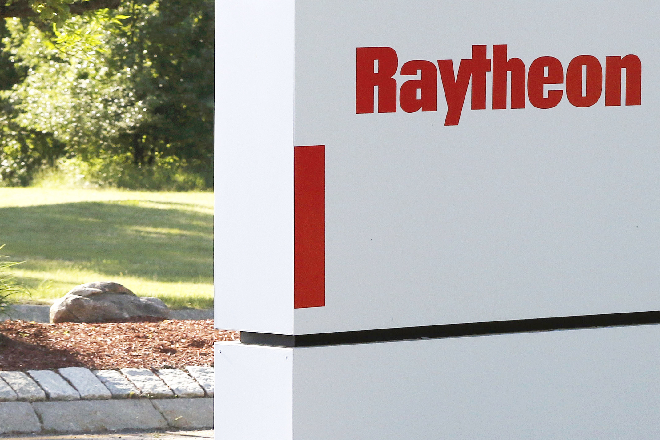 FILE - A sign stands at the road leading to the Raytheon facility in Marlborough, Mass., on June 10, 2019. The major defense contractor was sued Tuesday, June 11, 2024 over allegations that it discriminated against older workers in job ads. (AP Photo/Bill Sikes, File)