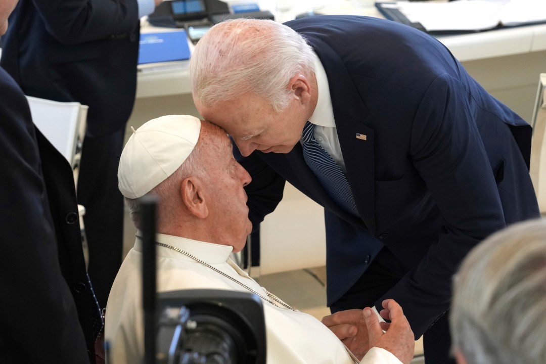 U.S. President Joe Biden, right, greets Pope Francis ahead of a working session on Artificial Intelligence (AI), Energy, Africa-Mediterranean, on day two of the 50th G7 summit at Borgo Egnazia, southern Italy, on Friday, June 14, 2024. (Christopher Furlong/Pool Photo via AP)