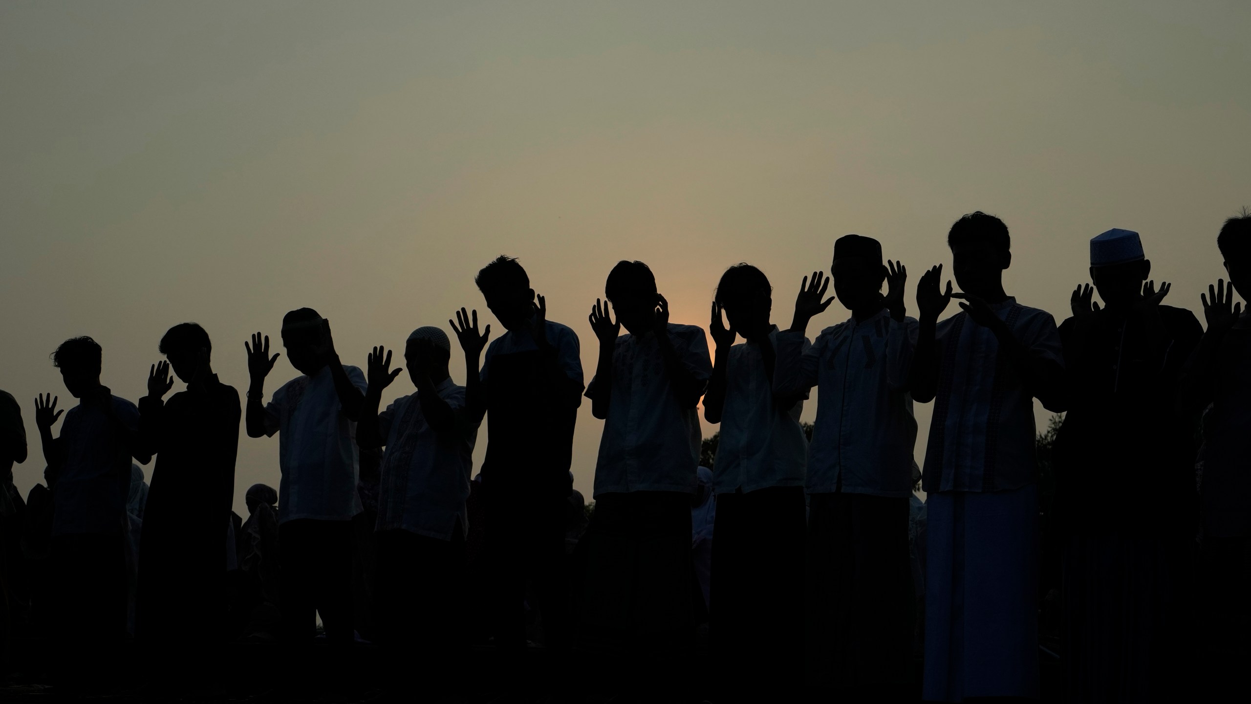 Muslims perform Eid al-Adha prayer on a street in Jakarta, Indonesia, Monday, June 17, 2024. Muslims around the world celebrate Eid al-Adha by sacrificing animals to commemorate the prophet Ibrahim's faith in being willing to sacrifice his son. (AP Photo/Achmad Ibrahim)