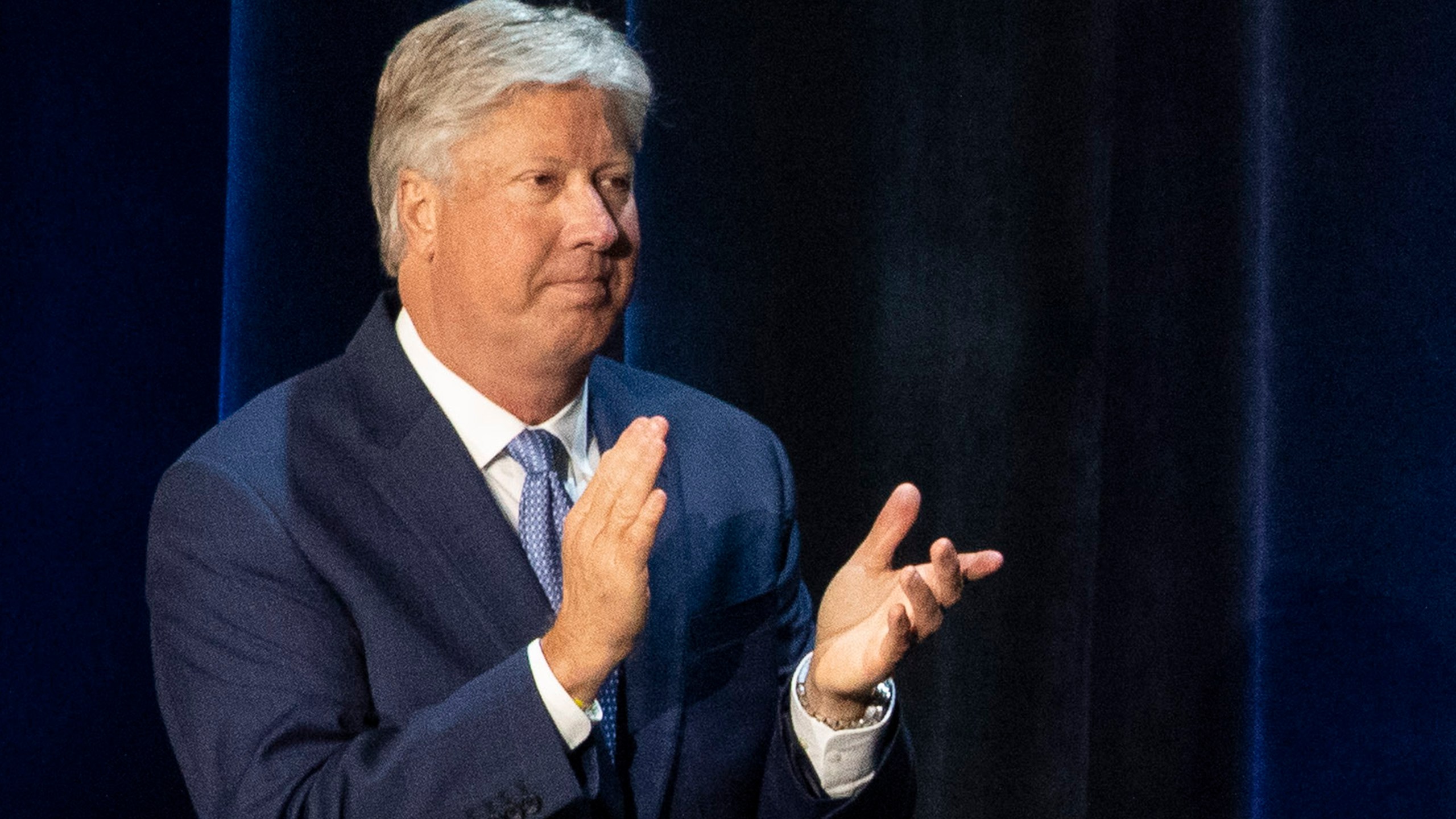 Robert Morris applauds during a discussion