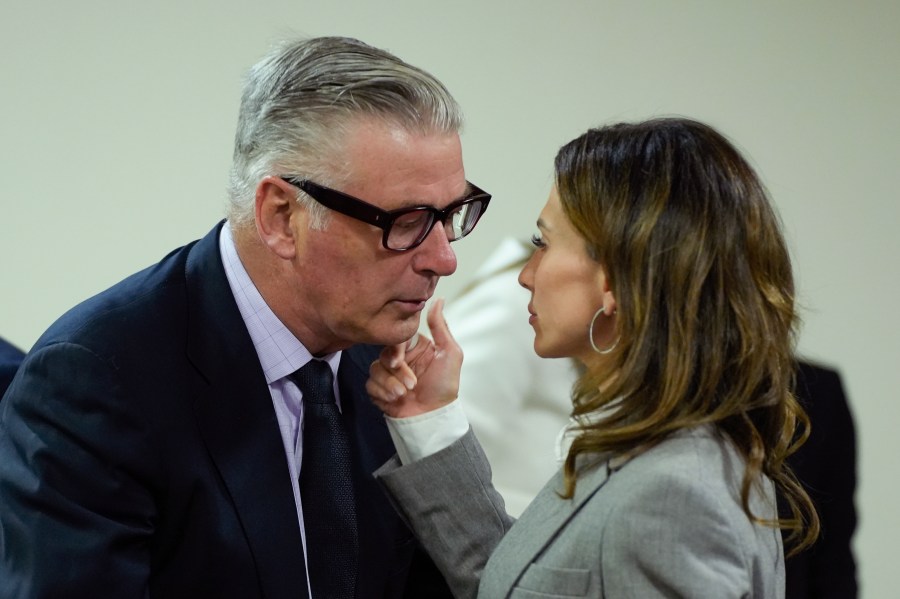 Hilaria Baldwin speaks to her husband, actor Alec Baldwin, during his trial for involuntary manslaughter for the 2021 fatal shooting of cinematographer Halyna Hutchins during filming of the Western movie "Rust," Friday, July 12, 2024, at Santa Fe County District Court in Santa Fe, N.M. (Ramsay de Give/Pool Photo via AP)