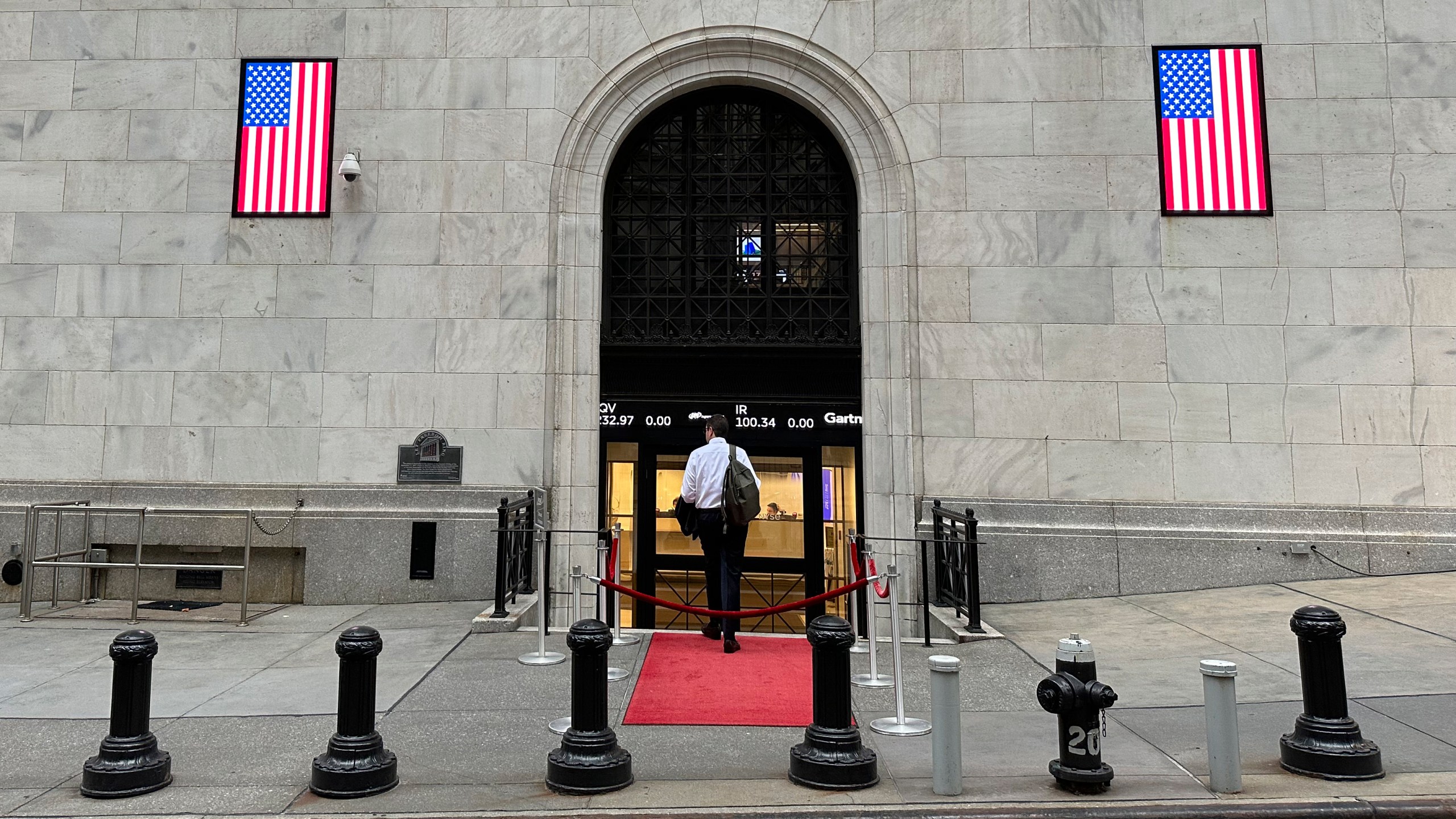 A man enters the New York Stock Exchange on Wednesday, July 17, 2024, in New York. Global stocks have mostly fallen, with shares in London declining after data showed the inflation rate remained steady at the Bank of England's 2% target in June. (AP Photo/Peter Morgan)