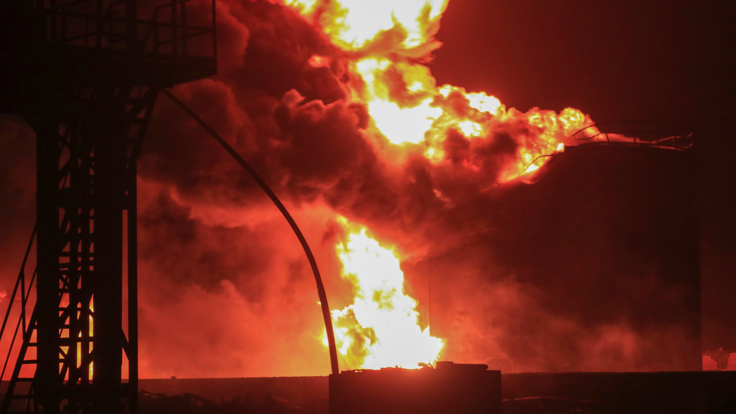 Oil tanks burn at the port in Hodeidah, Yemen, Saturday, July 20, 2024. The Israeli army said it has struck several Houthi targets in western Yemen following a fatal drone attack by the rebel group in Tel Aviv the previous day. (AP Photo)