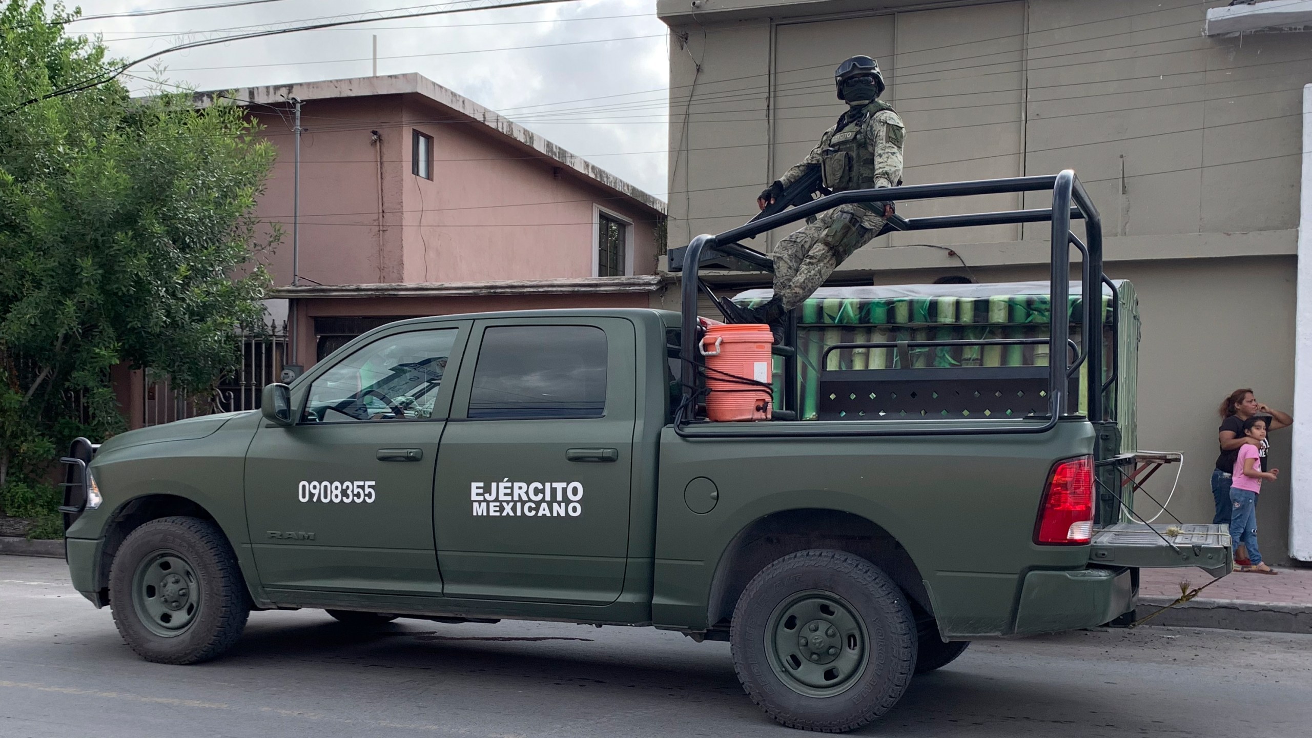 Mexican soldiers stand guard near the Tamaulipas Chamber of Commerce, where its president Julio Cesar Almanza was killed, in Matamoros, Mexico, Tuesday, July 30, 2024. (AP Photo/Veronica Cisneros)