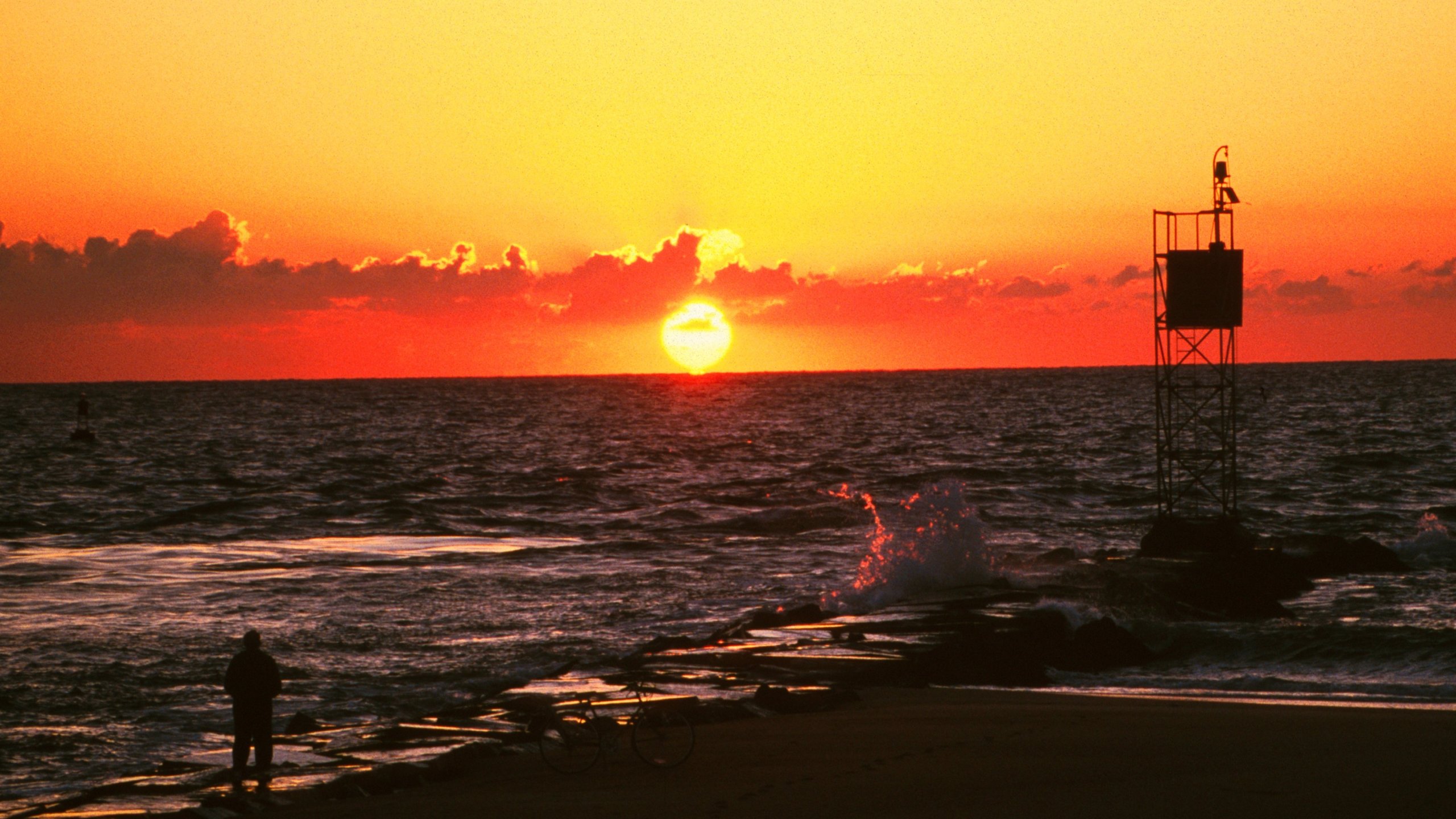 The sun rises over the Atlantic Ocean at Delaware State Seashore Park.