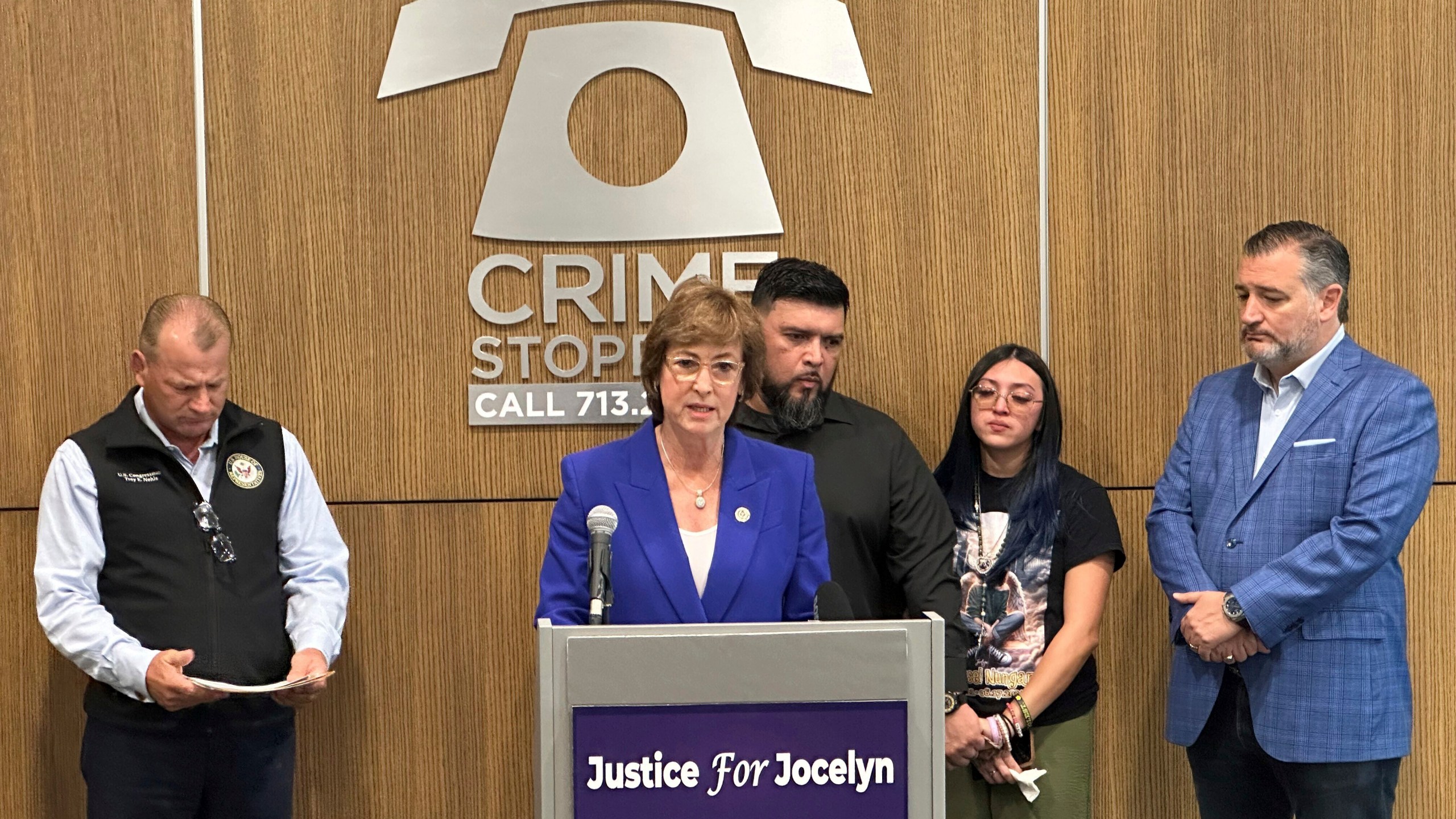 Harris County District Attorney Kim Ogg, center, speaks during a news conference in Houston on Friday, Aug. 2, 2024, about legislation related to the detention of immigrants that is being proposed in the wake of the killing of 12-year-old Jocelyn Nungaray. U.S. Sen. Ted Cruz stands at right. (AP Photo/Juan A. Lozano)