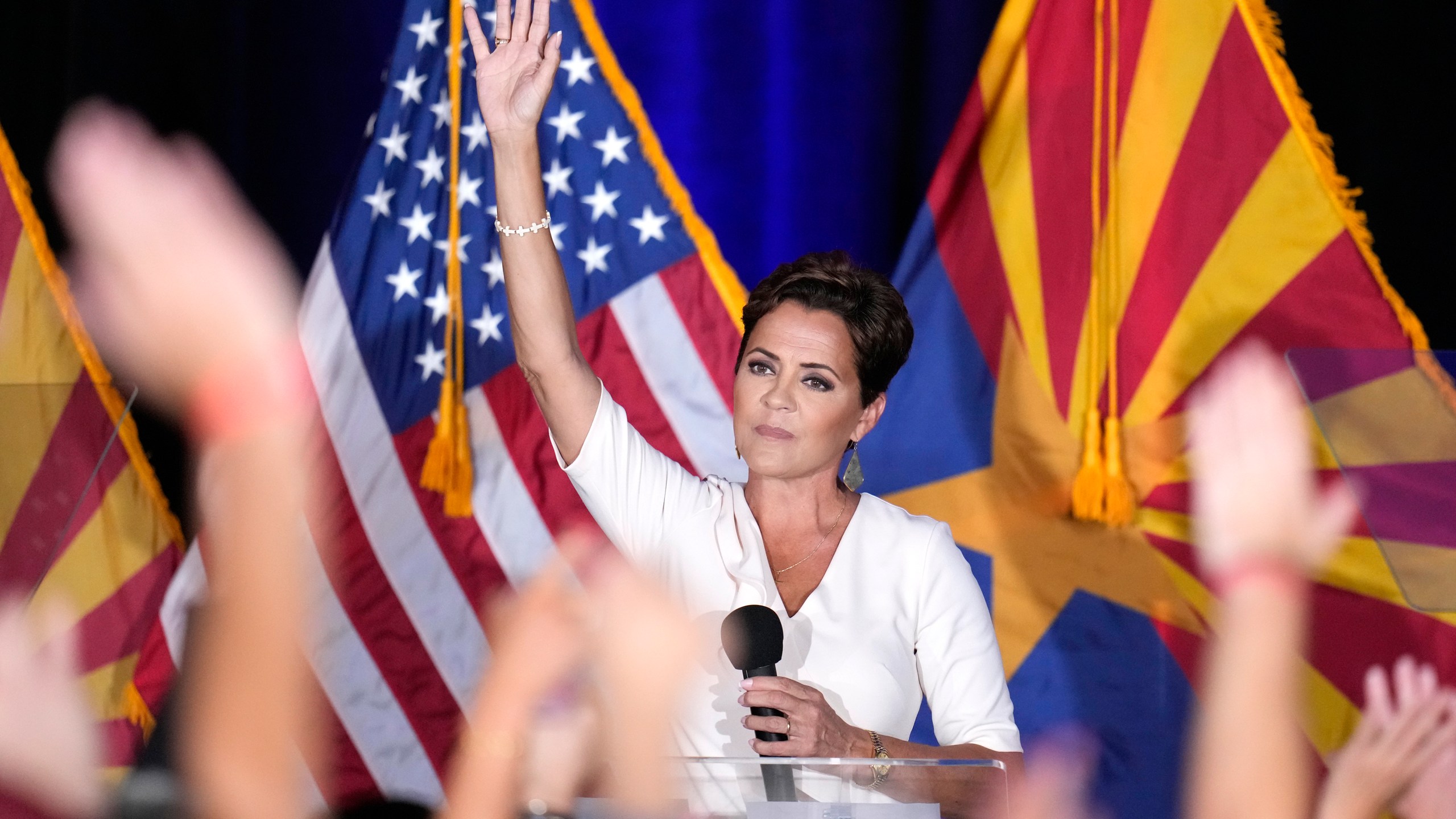 Republican Arizona Senate candidate Kari Lake waves to supporters after being declared the primary winner Tuesday, July 30, 2024, in Phoenix. (AP Photo/Ross D. Franklin)