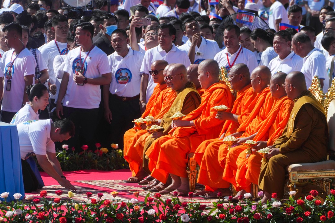 Cambodian Prime Minister Hun Manet and his wife Pich Chanmony, front left, receive blessings from Buddhist monks during a groundbreaking ceremony of China-funded Funan Techo canal that will connect the country’s capital Phnom Penh with Kep province on the country's south coast, Prek Takeo village, Kendal province, Cambodia, Monday, Aug. 5, 2024. (AP Photo/Heng Sinith)