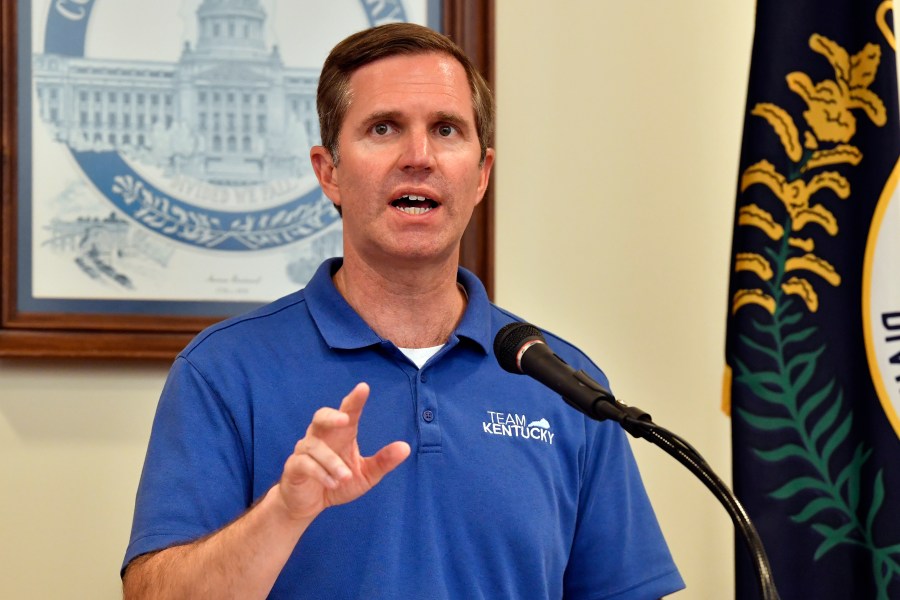 Kentucky Gov. Andy Beshear addresses a crowd gathered at the Breathitt Co. Courthouse to discuss progress in flood recovery efforts in Jackson, Ky., Friday, July 26, 2024. (AP Photo/Timothy D. Easley)