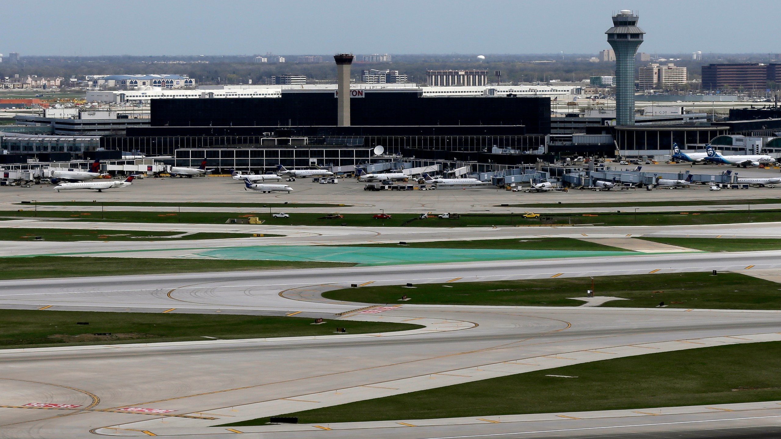 FILE - The O'Hare International Airport terminals are seen from the south air traffic control tower in Chicago, April 22, 2019. (AP Photo/Kiichiro Sato, File)