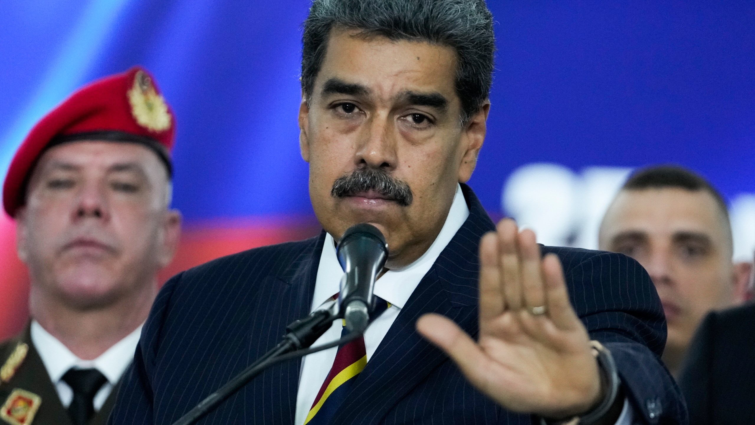 Venezuelan President Nicolas Maduro speaks to the press